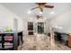 Spacious living room featuring tile flooring, ceiling fans, and access to the outdoor patio at 17645 E Stacey Rd, Queen Creek, AZ 85142