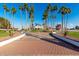 Long brick driveway leading to a classic home with mature landscaping and palm trees at 1859 N Val Vista Dr, Mesa, AZ 85213