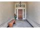 Inviting entryway with a wooden door and bench at 19326 E Silver Creek Ln, Queen Creek, AZ 85142