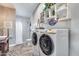 Laundry room with washer, dryer and additional storage at 19326 E Silver Creek Ln, Queen Creek, AZ 85142