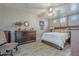 Main bedroom with a large bed and wood dresser at 197 N Pottebaum Ave, Casa Grande, AZ 85122