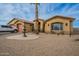 Exterior features a three-car garage, fountain, and palm trees in front at 197 N Pottebaum Ave, Casa Grande, AZ 85122