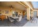 Covered patio with dining set and ceiling fan at 197 N Pottebaum Ave, Casa Grande, AZ 85122