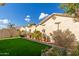 Landscaped backyard with artificial turf and potted plants at 21056 E Avenida Del Valle --, Queen Creek, AZ 85142