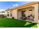 Covered patio with artificial turf, grill, and seating area at 21056 E Avenida Del Valle --, Queen Creek, AZ 85142
