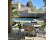 Community pool with patio furniture and lounge chairs at 21056 E Avenida Del Valle --, Queen Creek, AZ 85142
