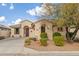 One-story house with desert landscaping and a two-car garage at 21056 E Avenida Del Valle --, Queen Creek, AZ 85142
