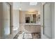 Double vanity bathroom with a large soaking tub at 215 N Power Rd # 440, Mesa, AZ 85205