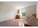 Bright bedroom with wood floors and ample natural light at 215 N Power Rd # 440, Mesa, AZ 85205