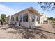 Exterior view of the house, showcasing a sunroom and landscaping at 215 N Power Rd # 440, Mesa, AZ 85205