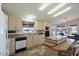 Spacious kitchen with island, light wood cabinets, and stainless steel appliances at 215 N Power Rd # 440, Mesa, AZ 85205