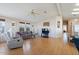 Living room with hardwood floors and plaid couch at 215 N Power Rd # 440, Mesa, AZ 85205