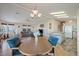 Open living room features a sofa, recliner, and a view into the kitchen and dining area at 215 N Power Rd # 440, Mesa, AZ 85205