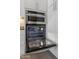 Stainless steel wall oven and microwave combo in a modern kitchen setting at 2207 W Camargo Dr, Anthem, AZ 85086