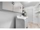 Laundry room with washer, dryer, and ample storage at 2607 N 74Th Pl, Scottsdale, AZ 85257