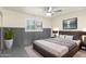 Main bedroom with dark grey platform bed and accent wall at 2607 N 74Th Pl, Scottsdale, AZ 85257