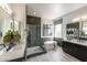 Luxurious bathroom with a soaking tub and walk-in shower at 33580 N Maverick Mountain Trl, San Tan Valley, AZ 85144