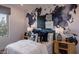 Guest bedroom with a world map wall and comfortable bed at 33580 N Maverick Mountain Trl, San Tan Valley, AZ 85144