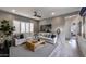 Cozy Gathering room with sectional sofa and built-in shelving at 33580 N Maverick Mountain Trl, San Tan Valley, AZ 85144
