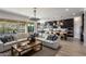 Open living space with modern sectional sofa and kitchen views at 33580 N Maverick Mountain Trl, San Tan Valley, AZ 85144
