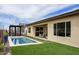 Inviting rectangular pool with grassy backyard and pergola at 33580 N Maverick Mountain Trl, San Tan Valley, AZ 85144