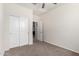 Cozy bedroom features carpeted floors, a ceiling fan, and a closet with sliding doors at 3481 N 309Th Ln, Buckeye, AZ 85396