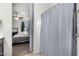 A view from the ensuite shows the main bedroom with a sliding barn door at 3481 N 309Th Ln, Buckeye, AZ 85396