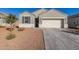 Charming single-story home with a two-car garage and low-maintenance desert landscaping at 3481 N 309Th Ln, Buckeye, AZ 85396