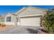 Charming single-story home featuring neutral stucco and a two-car garage at 3481 N 309Th Ln, Buckeye, AZ 85396