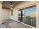 This covered patio has a ceiling fan and views of the backyard and neighborhood at 3481 N 309Th Ln, Buckeye, AZ 85396