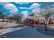 Community playground with slides, covered picnic tables, and bench seating offer outdoor recreation at 3481 N 309Th Ln, Buckeye, AZ 85396