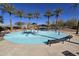 Community splash pad and playground with mature landscaping, shaded benches, and playground equipment at 3481 N 309Th Ln, Buckeye, AZ 85396