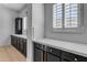 Pantry with white shelves, dark cabinets, and window at 3728 E Mia Ln, Gilbert, AZ 85298