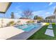 Relaxing pool area with artificial turf and stepping stones at 3728 E Mia Ln, Gilbert, AZ 85298