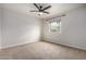 Bright bedroom with ceiling fan and neutral carpeting at 3814 E Wildwood Dr, Phoenix, AZ 85048