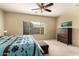 Large bedroom with king bed and dresser at 3836 N Hidden Canyon Dr, Florence, AZ 85132