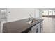 Kitchen island with sink and gray cabinets at 4212 E Brook Lynn Pl, San Tan Valley, AZ 85143