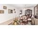 Formal dining room with a large table, hutch, and neutral decor at 4592 E Gleneagle Dr, Chandler, AZ 85249