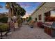 Spacious backyard patio with seating area, string lights, and built-in grill at 4808 N Litchfield E Knl, Litchfield Park, AZ 85340