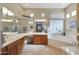 Large bathroom with double sinks, corner bathtub, and plenty of counter space at 4808 N Litchfield E Knl, Litchfield Park, AZ 85340