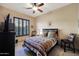 Cozy bedroom with southwest themed bedding and ceiling fan at 4808 N Litchfield E Knl, Litchfield Park, AZ 85340