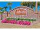 Welcoming Litchfield Greens sign surrounded by beautiful flowers and lush landscaping at 4808 N Litchfield E Knl, Litchfield Park, AZ 85340