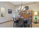 Formal dining room with a large wooden table and matching chairs at 4808 N Litchfield E Knl, Litchfield Park, AZ 85340