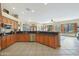 Open kitchen with granite countertops and stainless steel appliances at 4808 N Litchfield E Knl, Litchfield Park, AZ 85340