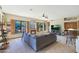 Open living room with a fireplace, and views to backyard at 4808 N Litchfield E Knl, Litchfield Park, AZ 85340