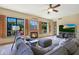 Bright living room featuring a fireplace and large windows at 4808 N Litchfield E Knl, Litchfield Park, AZ 85340