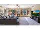 Spacious living room with a fireplace and access to the backyard at 4808 N Litchfield E Knl, Litchfield Park, AZ 85340