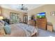 King-size bed in a spacious bedroom with lots of natural light at 4808 N Litchfield E Knl, Litchfield Park, AZ 85340