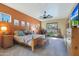 Large main bedroom with a king-size bed and wood dresser at 4808 N Litchfield E Knl, Litchfield Park, AZ 85340