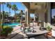 Relaxing patio with seating area and a view of the pool at 4808 N Litchfield E Knl, Litchfield Park, AZ 85340